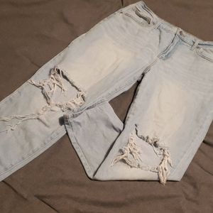 Distressed blue jeans.